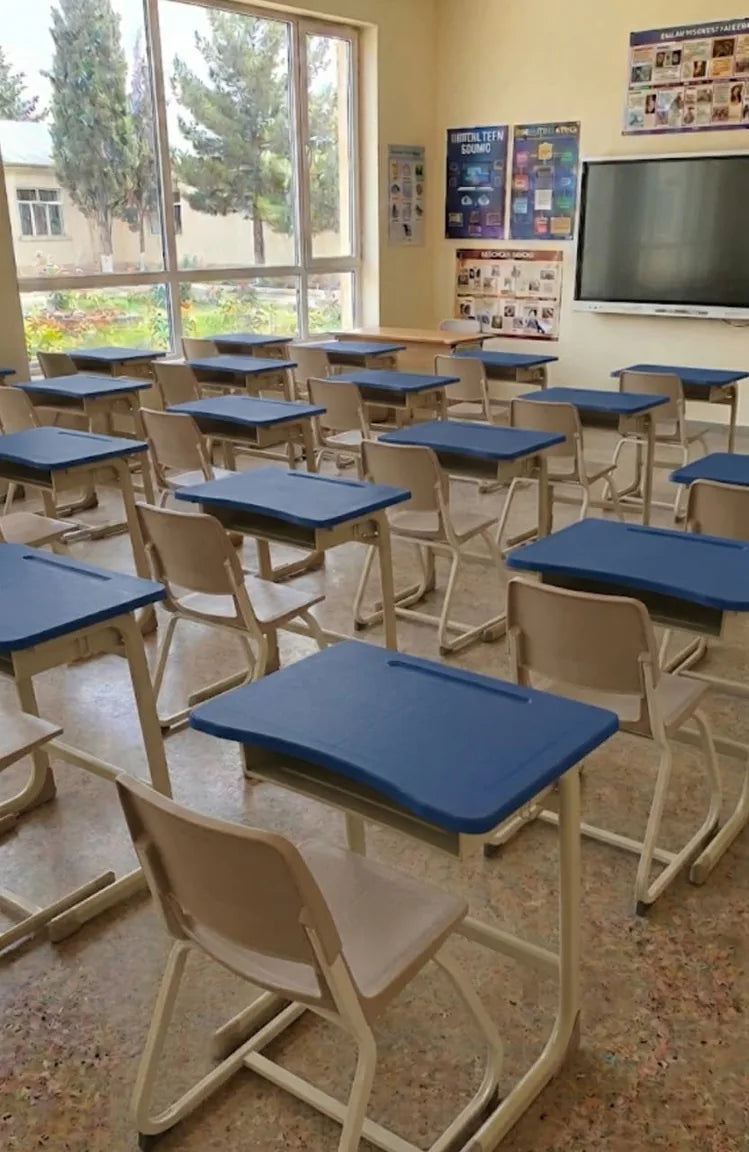 Blue classroom desks and chairs